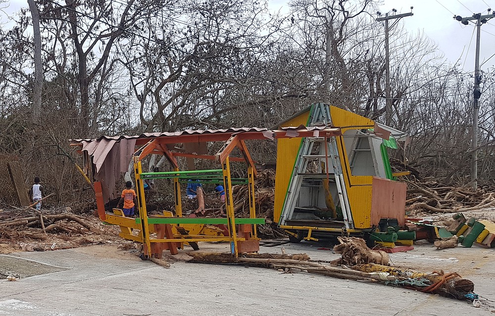 A structure stands in runs amid fallen branches after the passing of Hurricane Iota on San Andres island, Colombia, Tuesday, Nov. 17, 2020. Iota moved over the Colombian archipelago of San Andres, Providencia and Santa Catalina, off Nicaragua’s coast, as a Category 5 hurricane. (AP Photo/Christian Quimbay)