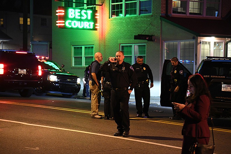 Hot Springs Police Chief Chris Chapmond walks across the 600 block of Ouachita Avenue, near the scene of a fatal shooting that occurred at 5 p.m. on Tuesday. The victim was identified on Wednesday as Shane Roy Sowers, 43, of Hot Springs, and police said they have identified a person of interest in the case. - Photo by Grace Brown of The Sentinel-Record story.lead_photo.caption