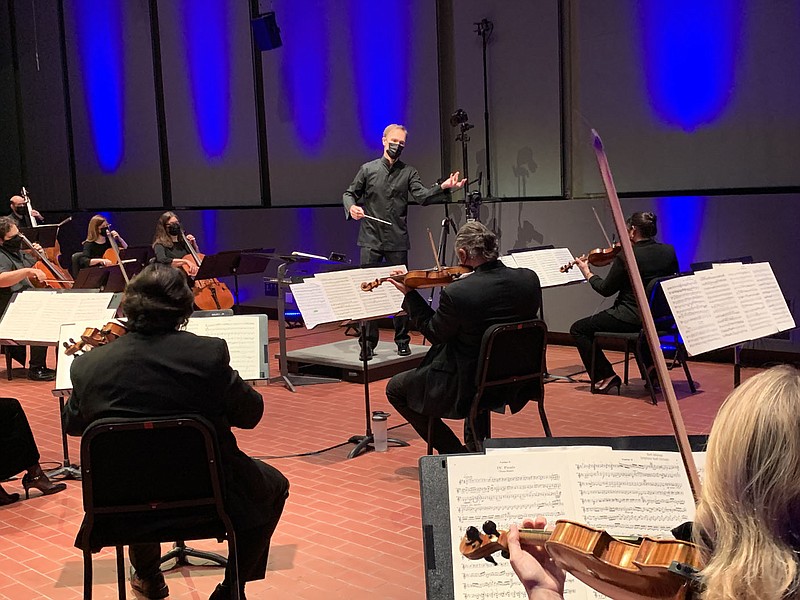 Paul Haas, music director for the Symphony of Northwest Arkansas, rehearses with his musicians for Saturday’s “Sounds of a Moment,” which will stream free at 8 p.m.

(Courtesy Photo)