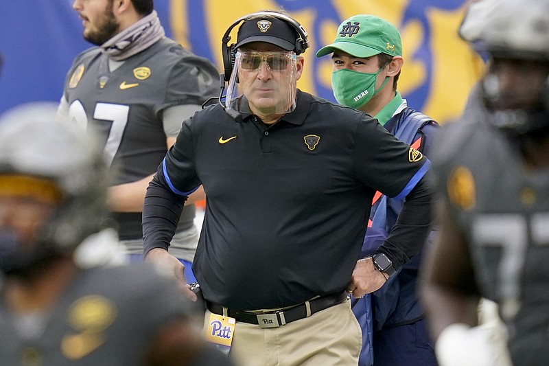 FILE - Pittsburgh head coach Pat Narduzzi wears a face shield as he watches his team play against Notre Dame during the first half of an NCAA college football game, Saturday, Oct. 24, 2020, in Pittsburgh. Narduzzi says Georgia Tech quarterback Jeff Sims' growth in making decisions is impressive for a freshman. Pitt's fierce pass rush will be a new test for Sims' ability to remain poised in the pocket on Saturday night. (AP Photo/Keith Srakocic, File)