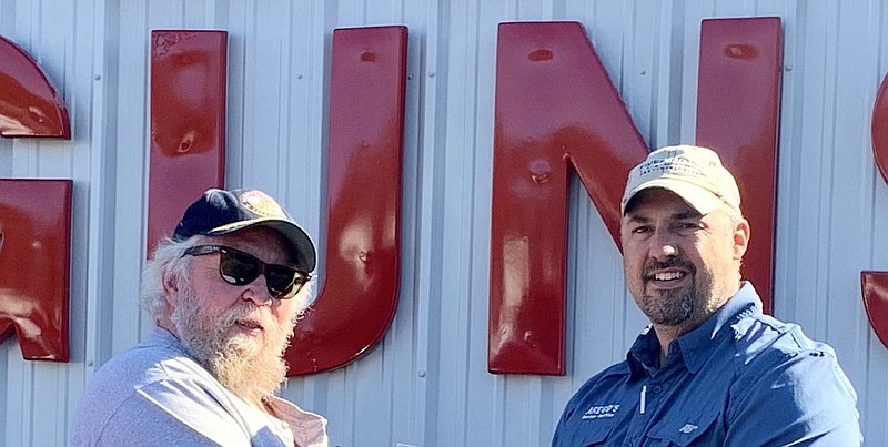 Disabled American Veterans Chapter 5 Commander Benny Arego, left, with Arego’s Guns co-owner Roger Latsha. - Submitted photo story.lead_photo.caption