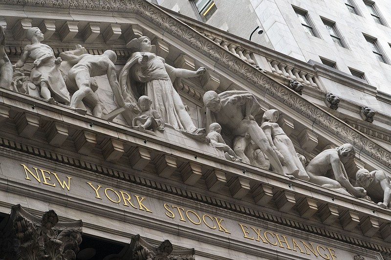 FILE - Stone sculptures adorn the New York Stock Exchange, Thursday, Nov. 5, 2020, in New York.  Stocks are opening lower on Wall Street, Thursday, Nov. 19,  as mounting coronavirus infections and evidence of the damage being cause to people's livelihoods rolls in.  (AP Photo/Mark Lennihan, File)