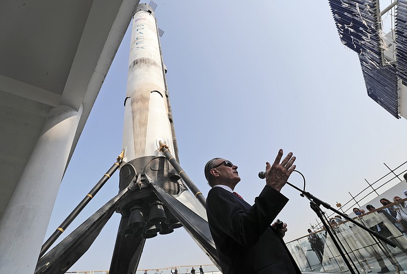 U.S. Ambassador John Rakolta talks in front of replica of the SpaceX Falcon 9, during the U.S.A Pavilion handover ceremony at the Dubai Expo 2020, United Arab Emirates, Wednesday, Nov. 18, 2020. The U.S. showed off a literally star-studded pavilion Wednesday for Dubai's upcoming Expo 2020, complete with a replica SpaceX rocket body beside it. (AP Photo/Kamran Jebreili) story.lead_photo.caption