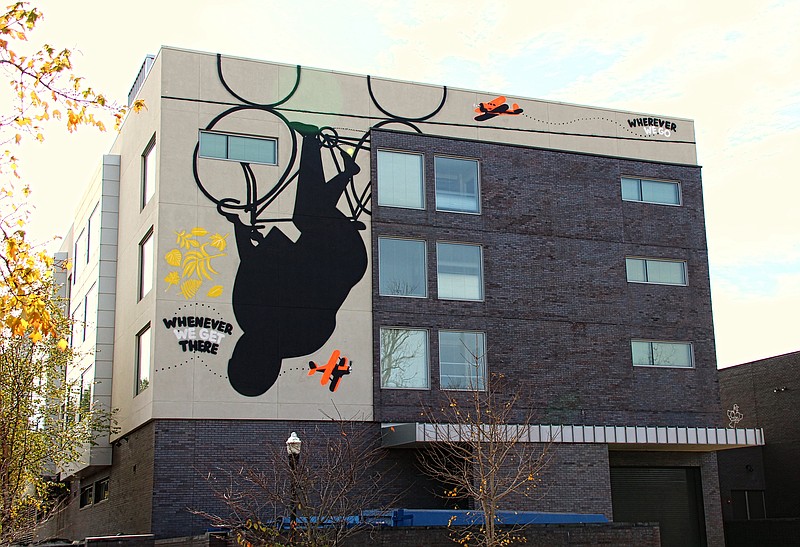 American mixed media artist Stephen Powers celebrates Bentonville's love of cycling with his mural at 200 N.E. A St., the north-facing wall of 21c Museum Hotel Bentonville.
ARkanvas connected 12 muralists with nine cities, where they crafted artworks to inspire and spark conversation on the theme "Unity." (Special to the Democrat-Gazette/Bob Robinson)