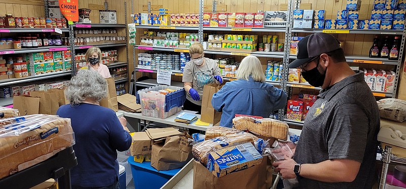 Volunteers keep the White Hall Food Pantry stocked and organized. Shown are, from left to right: Emily Lisenby, Kathy Benton, Melissa Henley, Donna Curtis and Cy Cheney. (Special to The Commercial)
