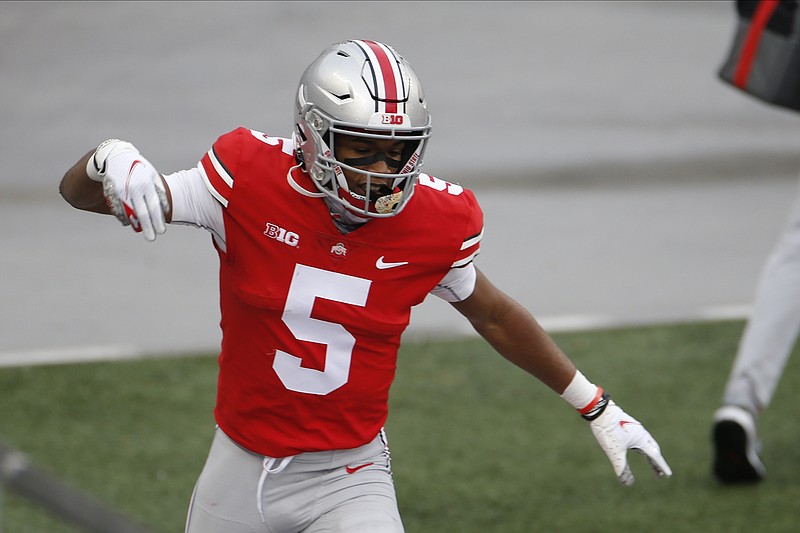 Ohio State receiver Garrett Wilson celebrates his touchdown against Indiana during the first half of an NCAA college football game Saturday, Nov. 21, 2020, in Columbus, Ohio. (AP Photo/Jay LaPrete)