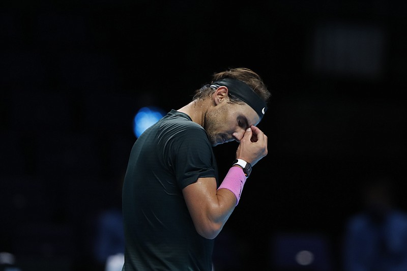 Rafael Nadal of Spain reacts during the semifinal match against Daniil Medvedev of Russia at the ATP World Finals tennis tournament at the O2 arena in London, Saturday, Nov. 21, 2020. (AP Photo/Frank Augstein)