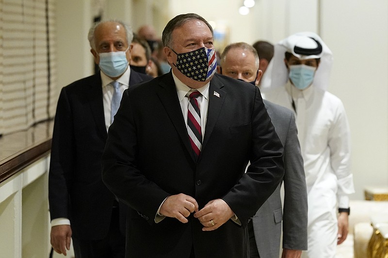 Secretary of State Mike Pompeo walks into a meeting with the Taliban's peace negotiation team amid talks between the Taliban and the Afghan government, Saturday, in Doha, Qatar. - AP Photo/Patrick Semansky