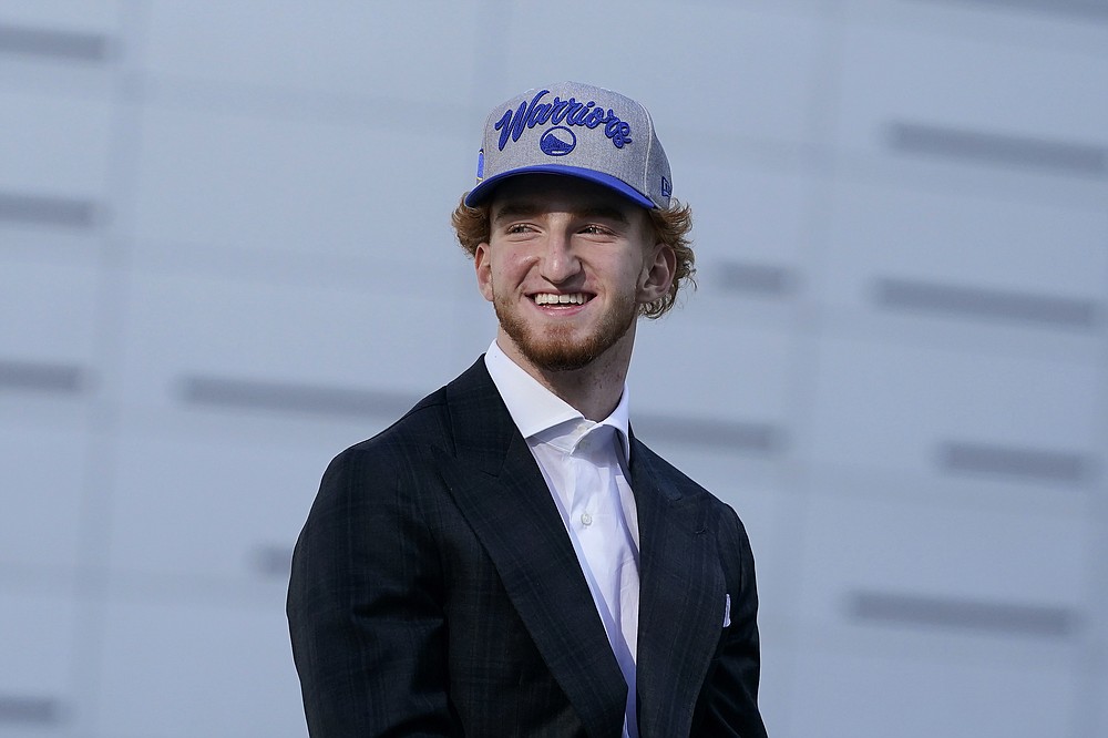 Golden State Warriors draft pick Nico Mannion smiles during a news conference in San Francisco, Thursday, Nov. 19, 2020. (AP Photo/Jeff Chiu)