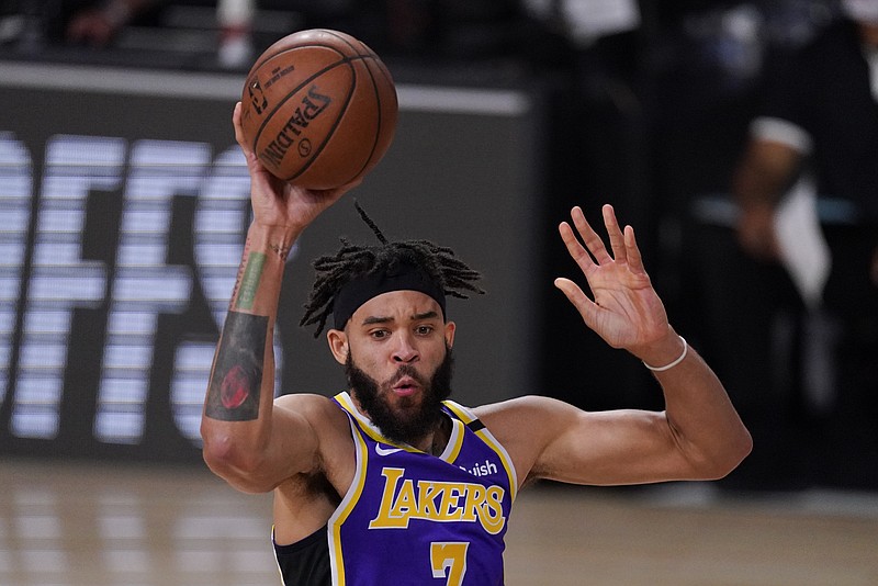 FILE - In this Sept. 4, 2020, file photo, Los Angeles Lakers' JaVale McGee passes the ball during the second half of an NBA conference semifinal playoff basketball game against the Houston Rockets in Lake Buena Vista, Fla. Looking to replace Tristan Thompson, the Cleveland Cavaliers have acquired McGee and a future draft pick from the Lakers for forwards Alfonzo McKinnie and Jordan Bell, a person familiar with the deal told The Associated Press on Sunday, Nov. 22, 2020. (AP Photo/Mark J. Terrill, File)