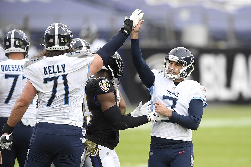 Tennessee Titans kicker Stephen Gostkowski, right, celebrates after kicking a field goal against the Baltimore Ravens during the first half of an NFL football game, Sunday, Nov. 22, 2020, in Baltimore. (AP Photo/Nick Wass)