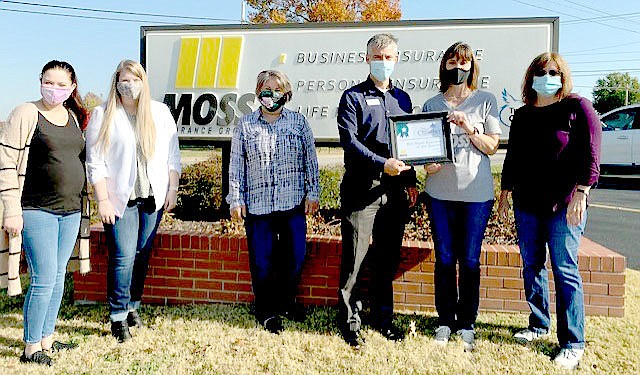 Photo Submitted Moss Insurance won Business of the Quarter for the third quarter (July, August and September). Moss won for the category of mid-size business. Moss won the award on Nov. 13 Every quarter chamber ambassadors vote on and choose the winner of businesses for small (0-5 employees), mid-size (6-100 employees) and large (101+ employees) businesses. Chamber ambassadors look for businesses or key people in each of the businesses who are having a very positive impact on our community or region.