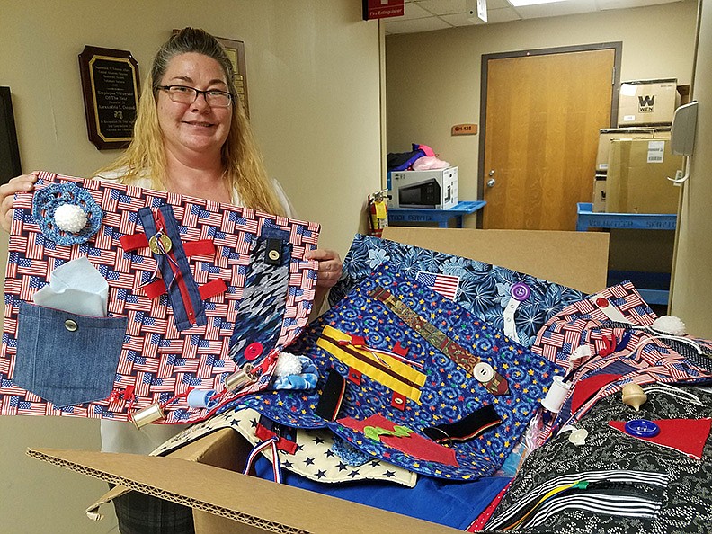 Sarah Carlisle, CAVHS Volunteer Services specialist, unpacks “Fidget Blankets.” - Submitted photo
