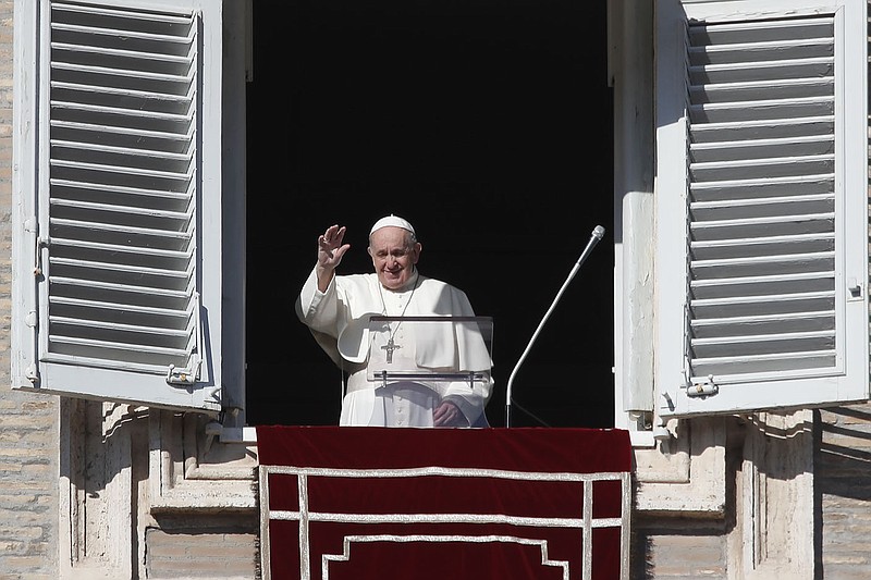 Pope Francis waves as he arrives for the Angelus noon prayer from the window of his studio overlooking St.Peter’s Square, at the Vatican, Sunday, Nov. 22, 2020.
(AP/Alessandra Tarantino)