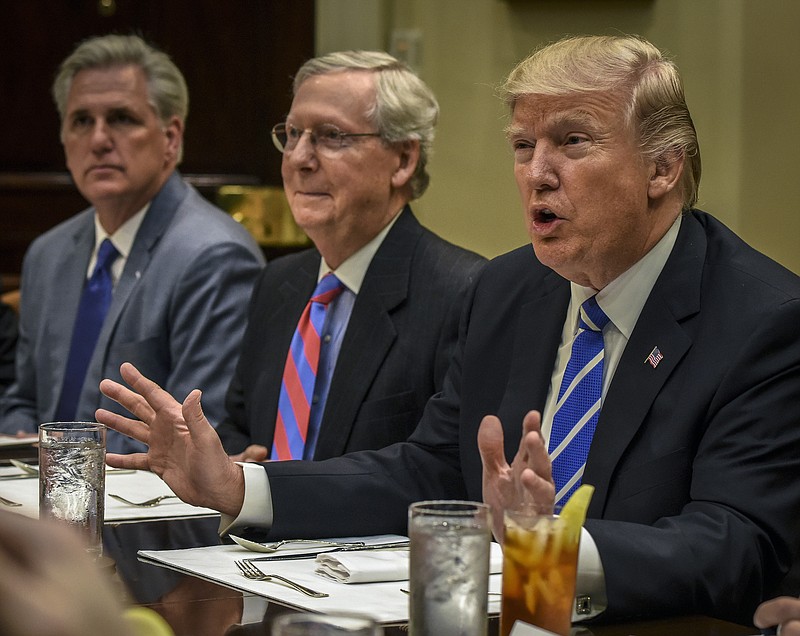 President Donald Trump, right, meets with Republican leadership, including Senate Majority Leader Mitch McConnell of Kentucky, center, and House Minority Leader Kevin McCarthy of California in 2017. MUST CREDIT: Washington Post photo by Bill O'Leary