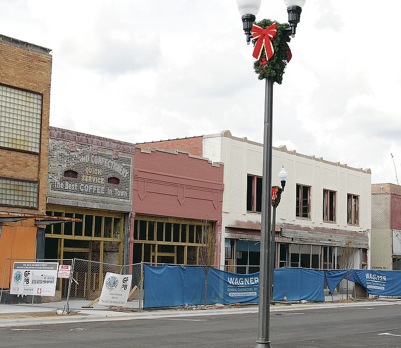 The three buildings being renovated by Urban Renewal Agency sit in historic Downtown Pine Bluff at 316, 322, and 324 Main St. According to documents from the Pine Bluff Historical Society, the building at right, which is now 316 Main St., used to be two buildings, one of which housed Newberry's lunch counter in the mid-20th Century, where sit-ins were held during the Civil Rights movement. The center building, 322 Main St., was once home to Wilson Bros. Drug Store and Lewis E. Duncan, physician, and it later housed Lea's Men's Store in the late 1950s and 1960s, according to the Historical Society. At left, 324 Main, from 1908 to 1913, was the home of Pine Bluff Fruit Co., then possibly Palais Royal around 1927, and then Kinney Shoes. (Pine Bluff Commercial/Dale Ellis