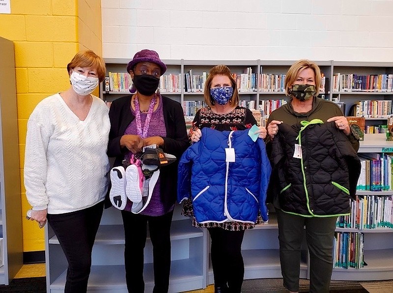 From left are Vice President Peggy Holt, Ms. Purple Paraprofessional, Guidance Counselor Denise Ludlow and Media Specialist Nancy Stokes. Coats for Kids is one of the sorority’s annual philanthropic projects. - Submitted photo