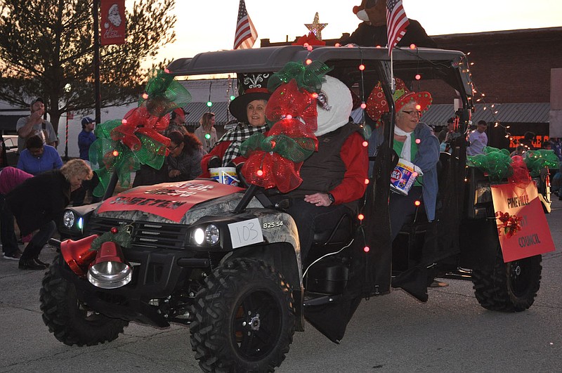FILE PHOTO Pineville City Council members wore festive hats in the 2019 lighted Christmas parade on the square.