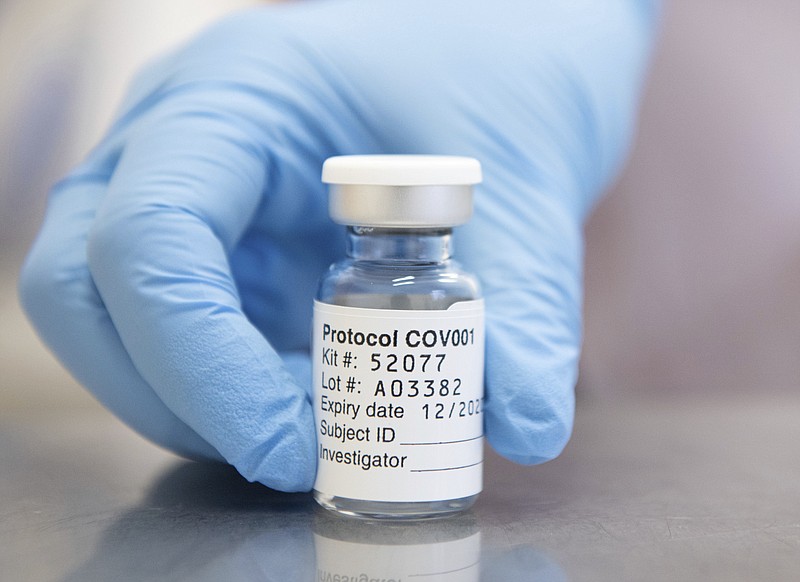 FILE - This undated  file photo issued by the University of Oxford on Monday, Nov. 23, 2020, shows of vial of coronavirus vaccine developed by AstraZeneca and Oxford University, in Oxford, England. With major COVID-19 vaccines showing high levels of protection, British officials are cautiously — and they stress cautiously — optimistic that life may start returning to normal by early April. Even before regulators have approved a single vaccine, the U.K. and countries across Europe are moving quickly to organize the distribution and delivery systems needed to inoculate millions of citizens. (University of Oxford/John Cairns via AP, File)