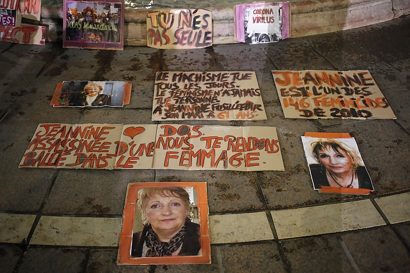 Posters of women victims of domestic violence are pictured at the Saint Michel fountain Wednesday in Paris. With domestic violence on the rise amid the pandemic, activists are holding protests Wednesday from France to Turkey and world dignitaries are trying to find ways to protect millions of women killed or abused every year by their partners. - AP Photo/Francois Mori