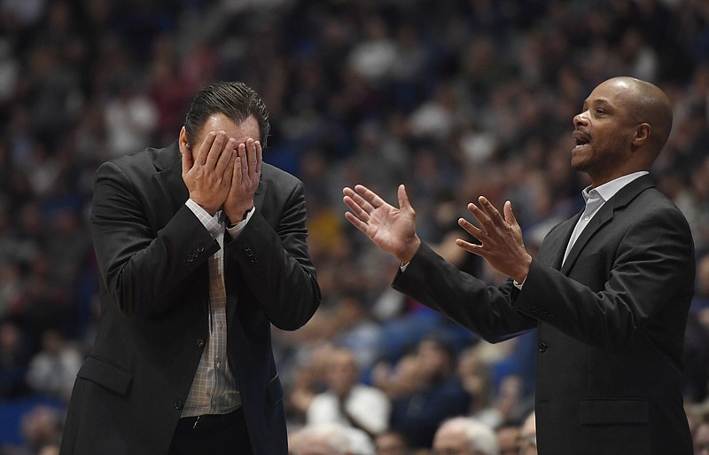 Wichita State head coach Gregg Marshall, left, and assistant coach Isaac Brown are shown during  the second half of an NCAA college basketball game in Hartford, Conn., Sunday, Jan. 12, 2020. Wichita State coach Gregg Marshall resigned Tuesday, Nov. 17, 2020, following an investigation into allegations of verbal and physical abuse, ending a tenure that soared to the Final Four and crashed on the eve of the upcoming season. Shockers assistant coach Isaac Brown will serve as the interim coach. (AP Photo/Jessica Hill, File)