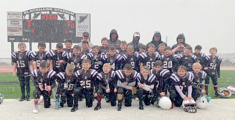 Photo submitted
The Siloam Springs Boys & Girls Club second/third-grade tackle football team won the Northwest Arkansas Youth Football League championship with a 14-0 win against Shiloh Christian on Nov. 14 at Blackhawk Stadium in Pea Ridge. Siloam Springs finished 7-0 in its first year back in the NWAYFL Conference. Team members are Gage Capps (1), Caleb Petty (2), Jace Hannah (3), Braylon Thompson (5), Scout Cameron (7), Judson Wright (8), Tanner Hollaway (9), Cruz Mundy (10), Elijah Carter (14), Gabriel Overbey (15), Frankie Velasquez (19), Tanner Anger (2), Parker Dykes (21), Austin Blossom (23), Ty Corder (24), Laiken Young (25), Brodie Spicer (28), Michael Garcia (34), Jude Price (44), Jensen Anderson (45), Brady Moss Jr. (50), Xander Daugherty (51), Trevor Cole (55), Mason Strickland (60), Hunter Stanfill (62), Benson Eiland (63), Areley Clayton (64), Wade Rice (66), Elijuah Olenick (68), Mason Morris (77), Maeson Pollock (87), and Karter Qualls (99). Coaches are Thad Eiland, Don Clark, Brandon Anderson, Trent Budder and Brad Thompson.