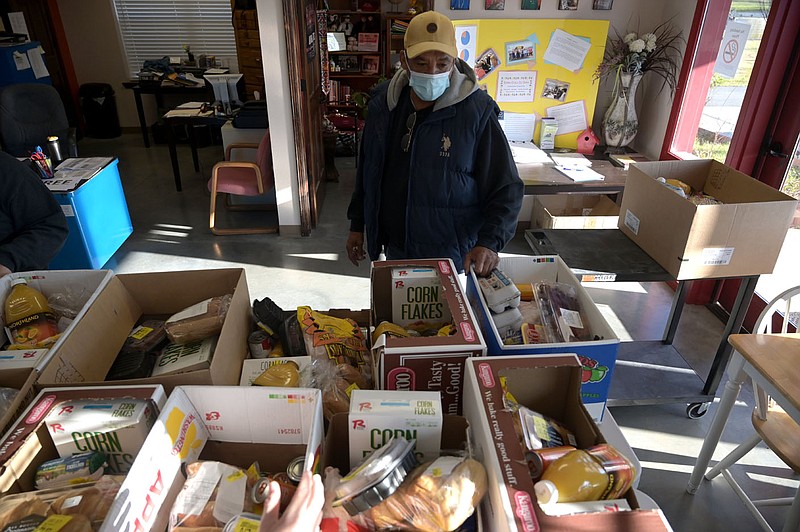 David Hargrave looks over a collection of food boxes as he prepares to open the Food Bank in Tuckerman on Monday, Nov. 23, 2020. The food bank served over 500 families, 1,010 individuals in October, Hargrave said. See more photos at arkansasonline.com/1126food/

(Arkansas Democrat-Gazette/Stephen Swofford)