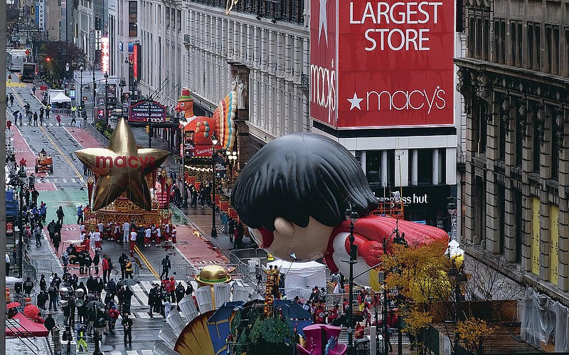 Floats that are part of the modified Macy's Thanksgiving Day Parade are seen from the Empire State Building in New York, Thursday, Nov. 26, 2020. Due to the pandemic, no crowds of onlookers were allowed to attend the annual parade. (AP Photo/Craig Ruttle)