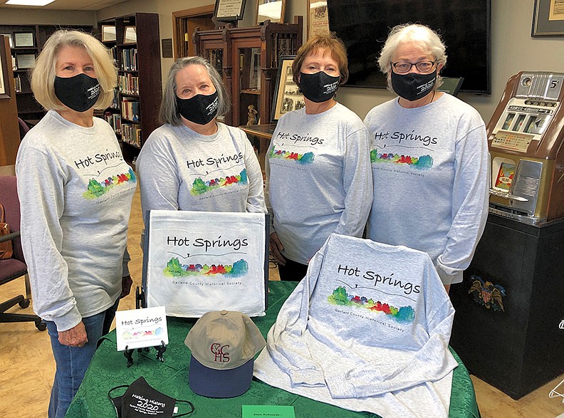 From left, Julie Brenner Nix, Bitty Martin, Carol Moenster Dyer and Liz Robbins display items that will be offered for sale at the Garland County Historical Society’s Outdoor Holiday House event from 10 a.m. to 3 p.m. Tuesday and Friday at the society’s building, 328 Quapaw Ave. - Submitted photo