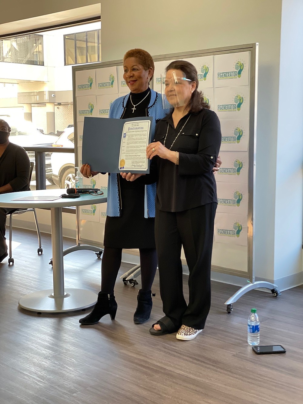 Mayor Shirley Washington, left, stopped by during Global Entrepreneurship activities at The Generator during the week and read a proclamation taking note of the week and the work that The Generator is doing. Mildred Franco, director of The Generator, is shown holding the proclamation. (Submitted photo)