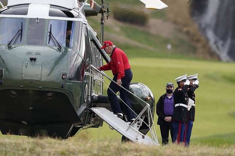 President Donald Trump, who continued Friday on Twitter to attack Democratic cities with large Black populations as the source of “massive voter fraud,” boards Marine One after playing golf at Trump National Golf Club in Sterling, Va. He flew to Camp David for the weekend. More photos at arkansasonline.com/1128count/.
(AP/Alex Brandon)