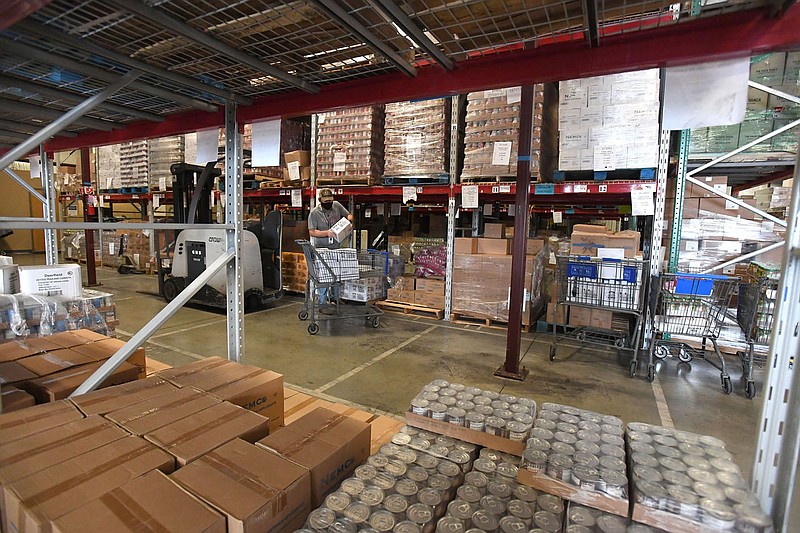 David Courtney loads an order for a local food pantry at the Northwest Arkansas Food Bank in Springdale Thursday Nov. 19, 2020. (NWA Democrat-Gazette/J.T. Wampler)