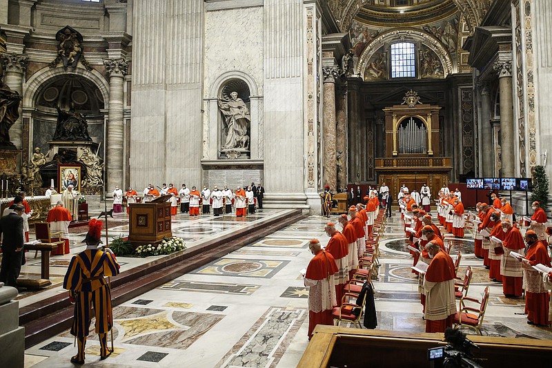 Pope Francis attends a consistory ceremony where 13 bishops were elevated to a cardinal's rank in St. Peter’s Basilica at the Vatican, Saturday, Nov. 28, 2020. (Fabio Frustaci/POOL via AP)