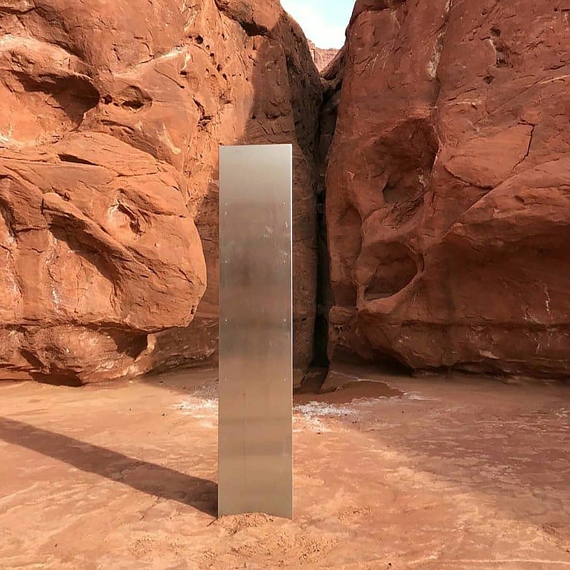 This Nov. 18 file photo provided by the Utah Department of Public Safety shows a metal monolith in the ground in a remote area of red rock in Utah. The mysterious silver monolith that was placed in the Utah desert has disappeared less than 10 days after it was spotted by wildlife biologists performing a helicopter survey of bighorn sheep, federal officials and witnesses said. The Bureau of Land Management said it had received credible reports that the three-sided stainless steel structure was removed on Friday. - Utah Department of Public Safety via AP