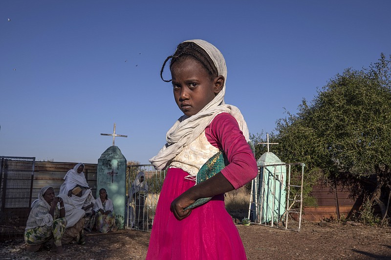 A Tigrayan girl who fled the conflict in Ethiopia's Tigray region prepares to leave after Sunday Mass ends at a church, near Umm Rakouba refugee camp in Qadarif, eastern Sudan. - AP Photo/Nariman El-Mofty