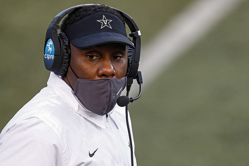 FILE - In this Oct. 31, 2020, file photo, Vanderbilt head coach Derek Mason looks on from the sideline during an NCAA college football game against Mississippi in Nashville, Tenn. Vanderbilt women's soccer goalkeeper Sarah Fuller has practiced with the football team, and coach Derek Mason says she's an option at kicker Saturday against Missouri. (AP Photo/Wade Payne, File)