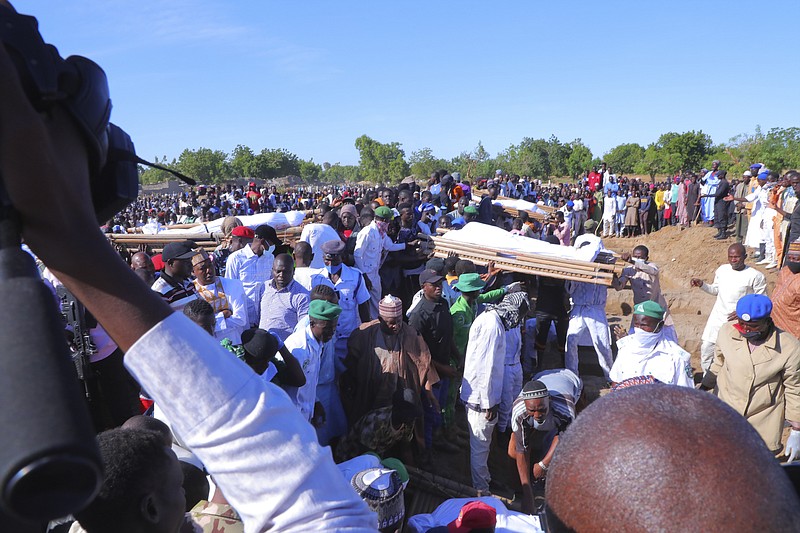 Funeral for victims of rice and fishermen farmers that were killed by suspected Boko Haram in Zaabarmar, Borno, Nigeria, Sunday, Nov 29, 2020. Suspected Boko Haram militants killed at least 40 rice farmers and fishermen while they were harvesting crops in Nigeria's northern Borno State, officials said. (AP Photo/Jossy Ola)