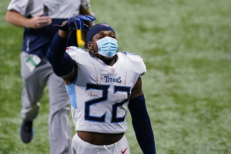 Tennessee Titans running back Derrick Henry (22) salutes fans as he walks off the field following Sunday's game against the Indianapolis Colts in Indianapolis. The Titans defeated the Colts 45-26. - Photo by Darron Cummings of The Associated Press