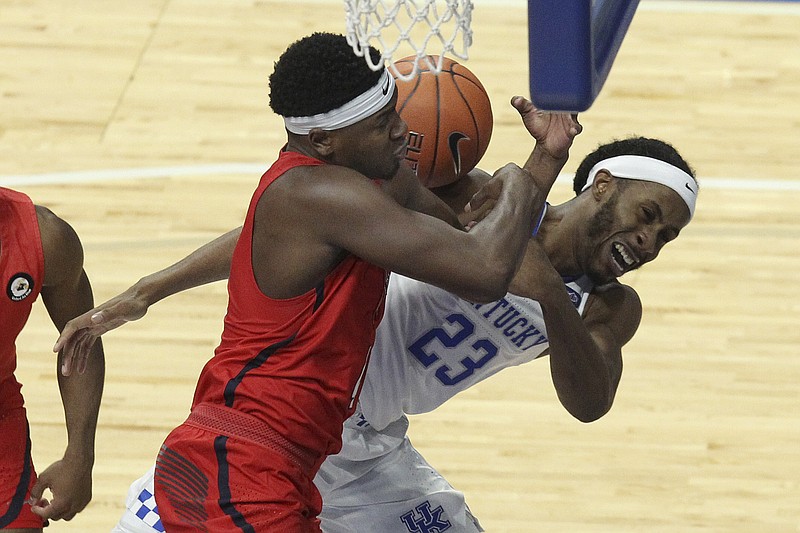 Kentucky's Isaiah Jackson (23) and Richmond's Nathan Cayo, left, battle for a rebound during the second half of Sunday's game in Lexington, Ky. - Photo by James Crisp of The Associated Press