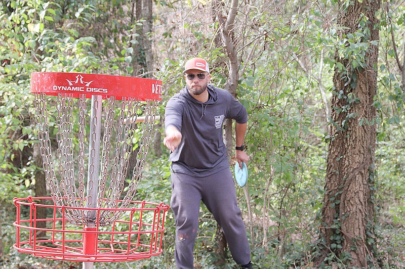 LYNN KUTTER ENTERPRISE-LEADER
Justin McNab of Bentonville participates in a disc golf tournament held last month at Creekside Park in Farmington and two other courses in Northwest Arkansas. The tournament was sponsored by Dynamic Discs.