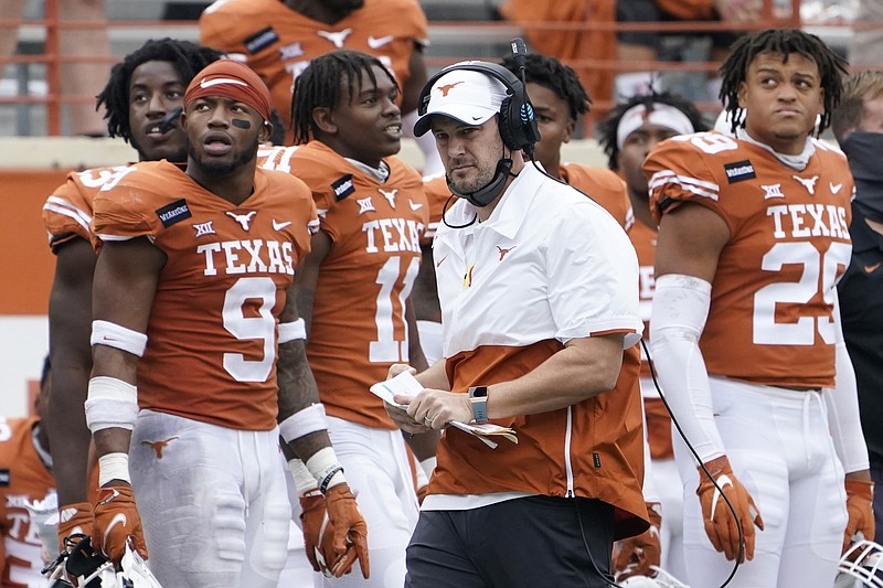 Texas head coach Tom Herman, center, walks on the sideline during the second half of a Nov. 27 game against Iowa State in Austin, Texas. Herman batted away questions about his future with the program on Monday and insisted on trying to keep the focus on the Longhorns' players trying to win their last two games of the season. - Photo by Eric Gay of The Associated Press