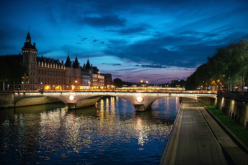 Empty embankment on the river Seine during lockdown due to the corona virus in Paris on April 16, 2020. There are countless ways to invite Paris into your home, all you need is a little creativity and perhaps a glass of Champagne. (Dmitry Kostyukov/The New York Times)