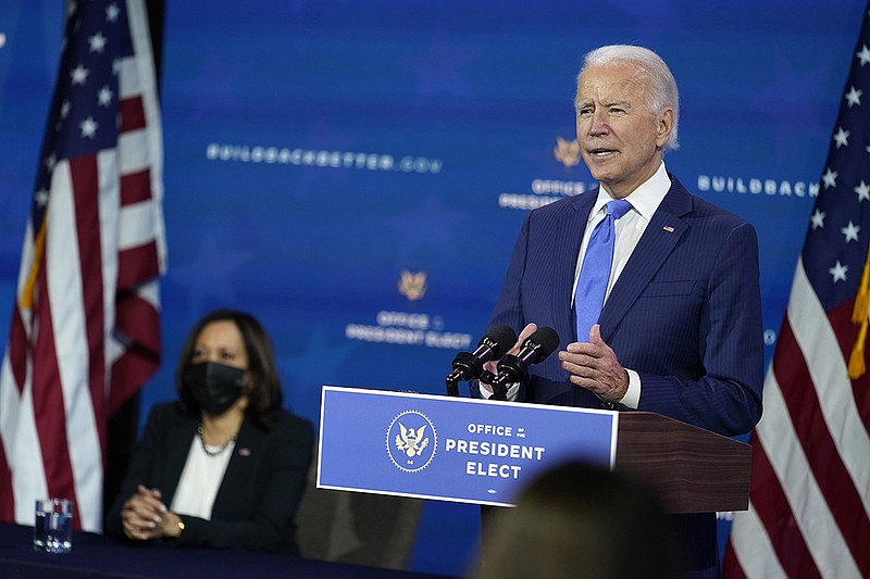 President-elect Joe Biden speaks as Vice President-elect Kamala Harris listens at left, during an event to introduce their nominees and appointees to economic policy posts at The Queen theater, Tuesday, Dec. 1, 2020, in Wilmington, Del. (AP Photo/Andrew Harnik)