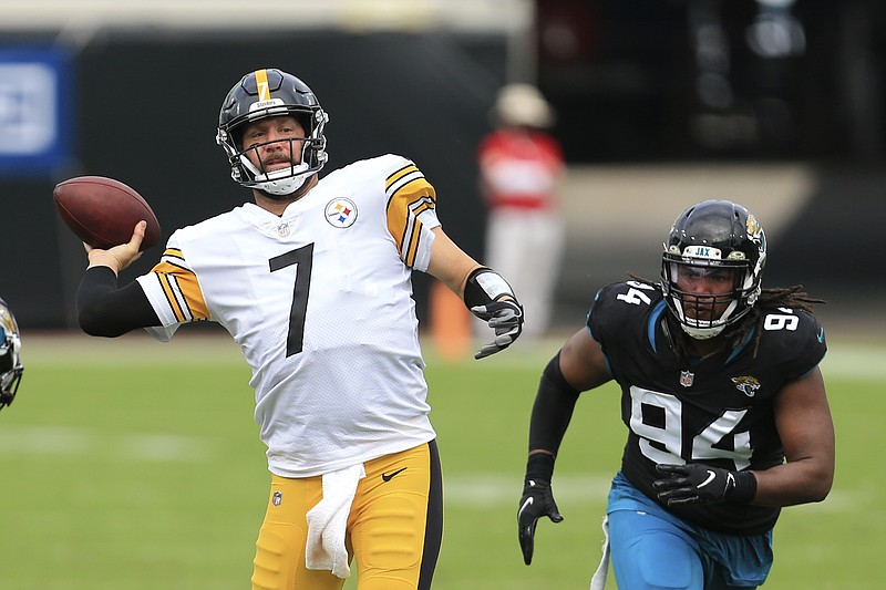 Pittsburgh Steelers quarterback Ben Roethlisberger (7) throws a pass as he gets around Jacksonville Jaguars defensive end Dawuane Smoot (94) during the first half of an NFL football game, Sunday, Nov. 22, 2020, in Jacksonville, Fla. (AP Photo/Matt Stamey)