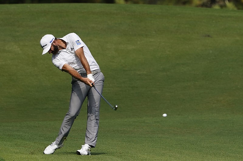 Dustin Johnson hits on the second fairway on Nov. 14 during the third round of the Masters in Augusta, Ga. His 5-iron set up eagle and was a pivotal shot in his victory. - Photo by Matt Slocum of The Associated Press