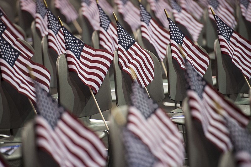 American flags await the more than 220 people from more than 40 countries participating in the Fiesta of Independence Naturalization Ceremony at South Mountain Community College in Phoenix on July 4, 2018. MUST CREDIT: Washington Post photo by Carolyn Van Houten.