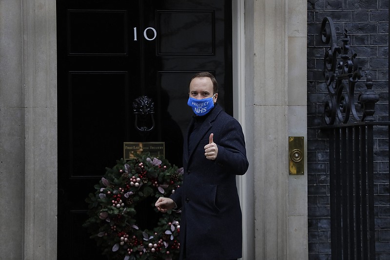 Britain's Health Secretary Matt Hancock gestures as he arrives at Downing Street in London, Wednesday, Dec. 2, 2020. U.K. Health Secretary Matt Hancock on Wednesday thanked scientists from Pfizer and BioNTech after the approval of their COVID-19 vaccine for emergency use by the country's drugs regulator. Speaking earlier Hancock gave details of how the vaccine would be distributed from the beginning of next week. (AP Photo/Kirsty Wigglesworth)