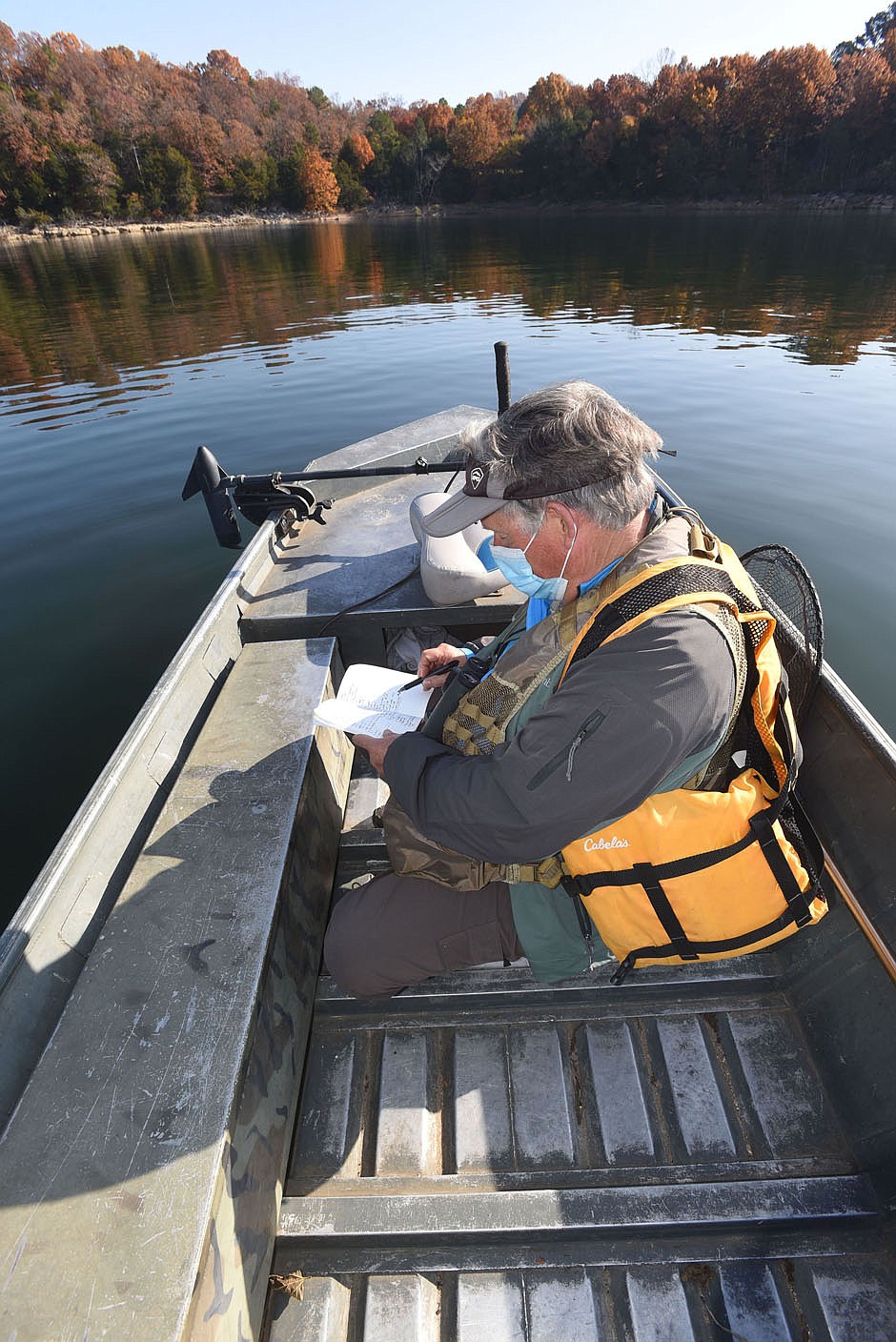 Neal jots down bird species seen Nov. 6 2020 during a morning of birding on Beaver Lake.
(NWA Democrat-Gazette/Flip Putthoff)