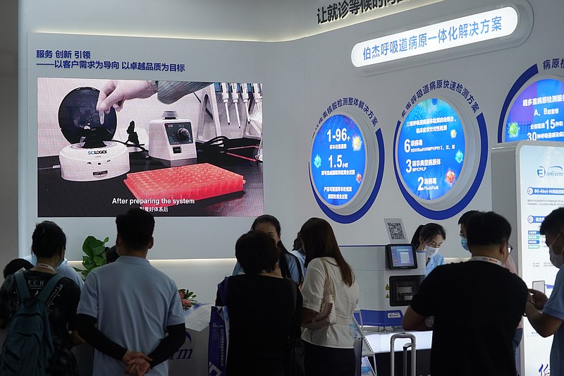 Shanghai-based testing kit company BioGerm presents a booth at a trade fair in Nanchang in eastern China's Jiangxi province on Aug. 21, 2020. BioGerm was one of three companies that gained privileged access to crucial information on the coronavirus from the Chinese Center for Disease Control and Prevention at the beginning of the outbreak, allowing them to make kits ahead of competitors. The move delayed China's response to the outbreak and caused critical shortages of kits. - AP Photo/Dake Kang