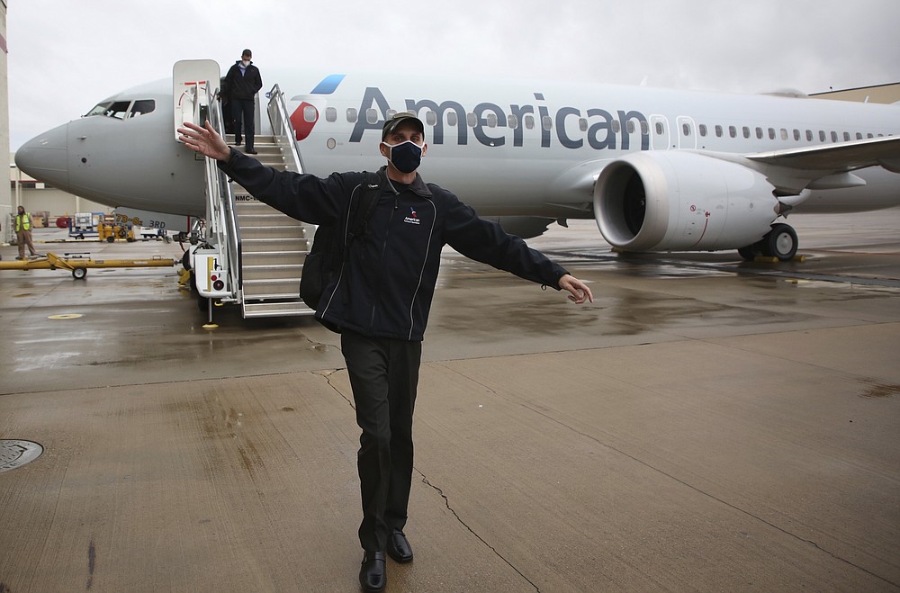 American Airlines Boeing 737 Max takes off at Tulsa International Airport to fly to Dallas, Wednesday, December 2, 2020 in Tulsa, Okla .. Earlier, the plane had flown a group of journalists and American Airlines employees from Dallas to American Airlines Tulsa maintenance facility. (Mike Simons / Tulsa World via AP)